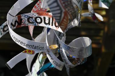 Hanging ribbons with words and colourful patterns on.